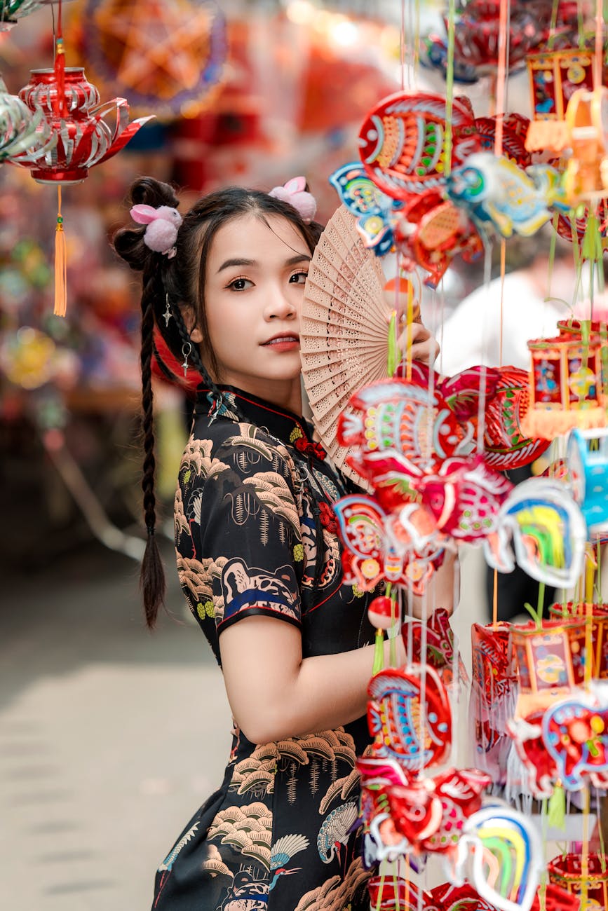 young chinese woman with a fan in her hand