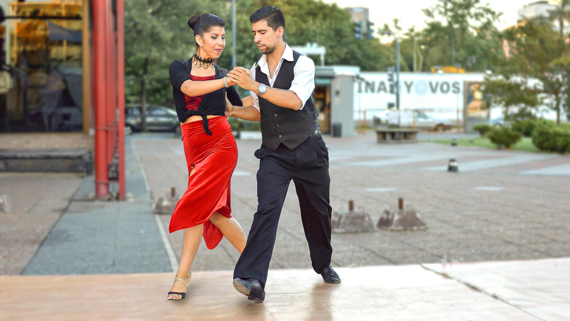 elegant couple dancing on street